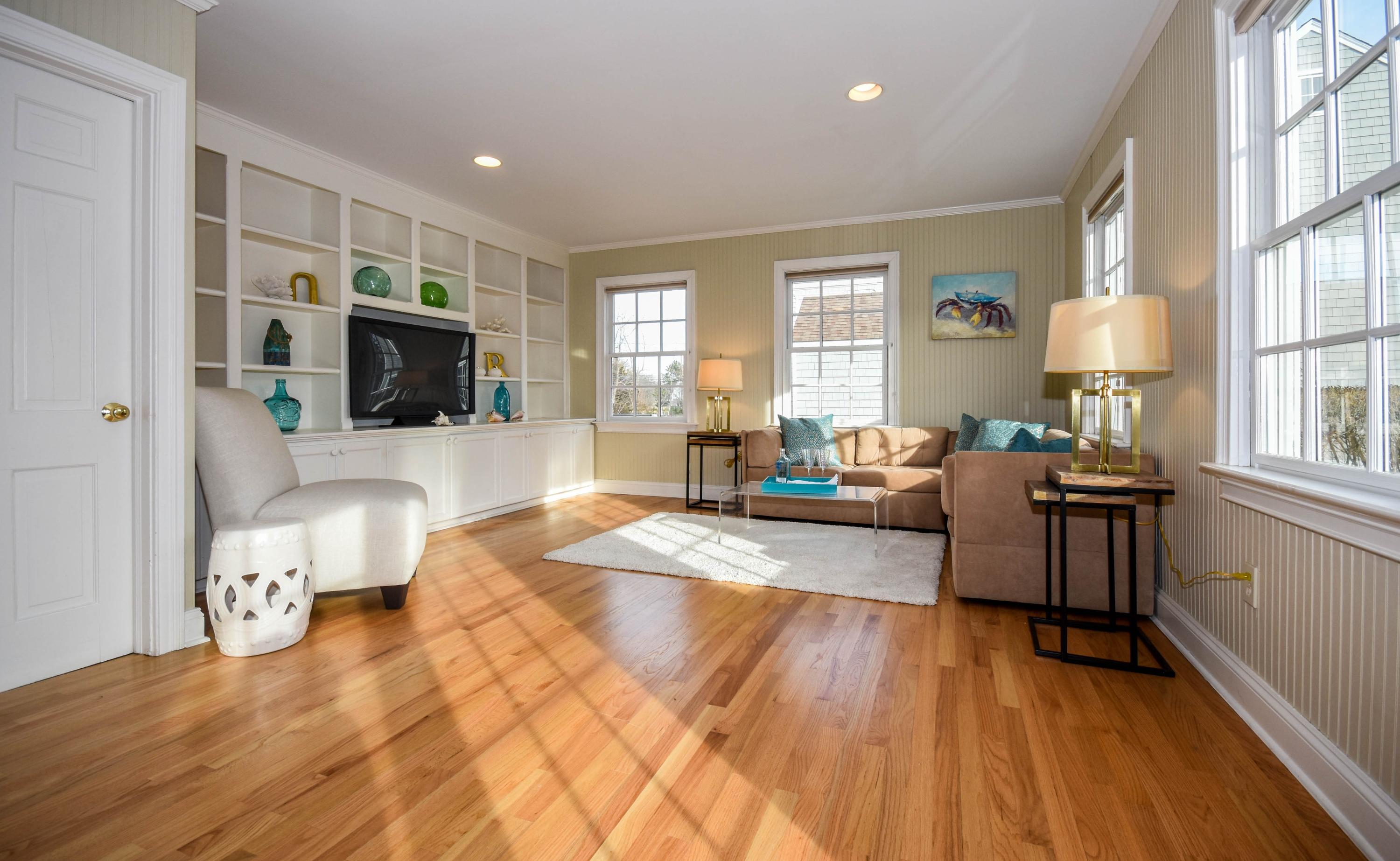 22 Meridian Road Rowayton, CT 06853 - Photo 11 of 25 a living room with furniture and a flat screen tv