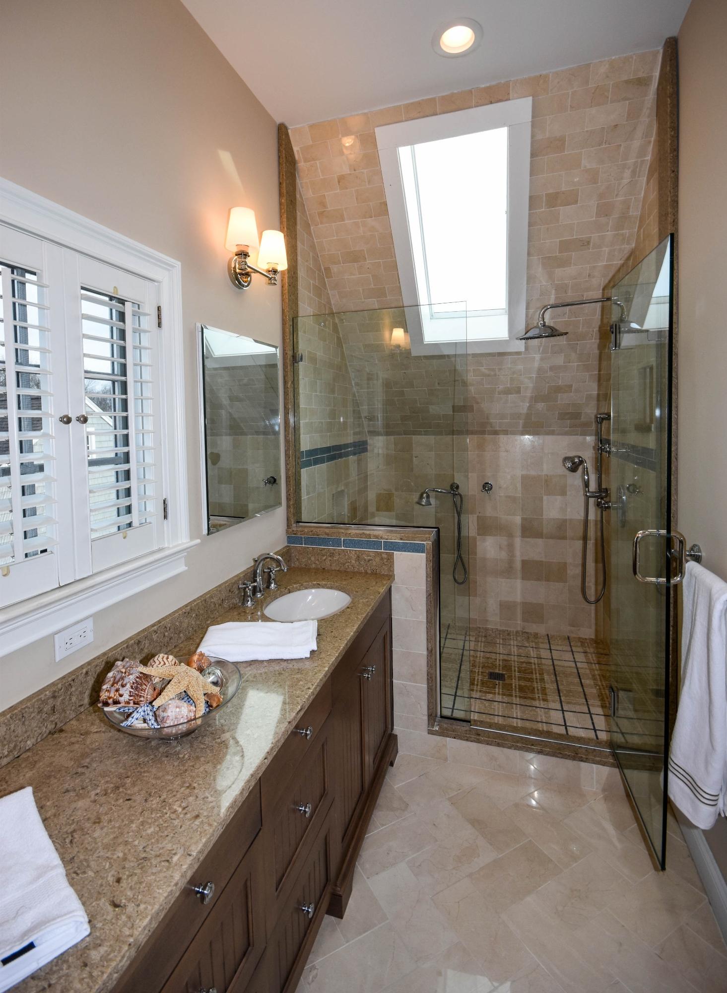 22 Meridian Road Rowayton, CT 06853 - Photo 18 of 25 a bathroom with a granite countertop sink a large mirror and a shower