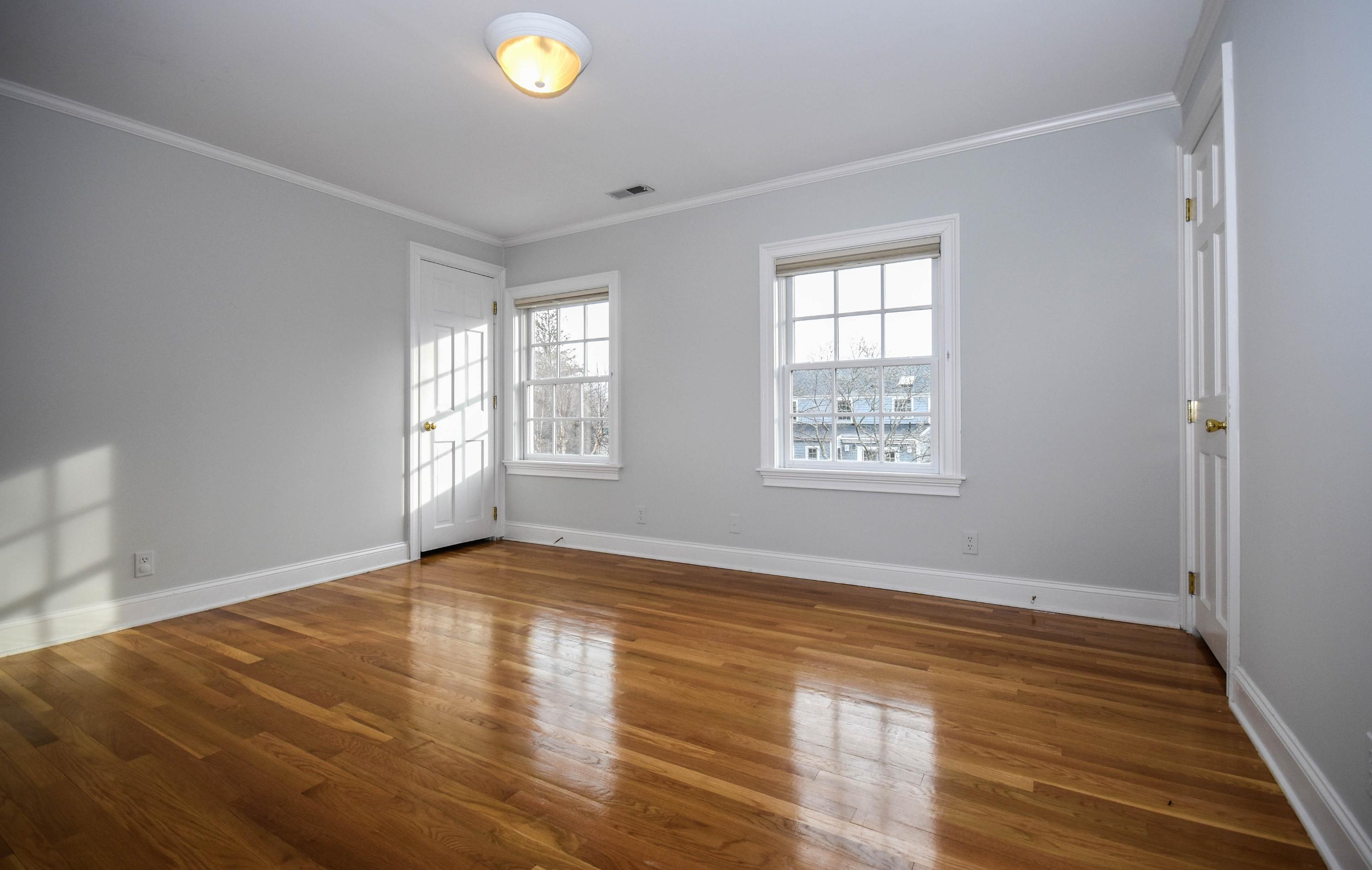 22 Meridian Road Rowayton, CT 06853 - Photo 20 of 25 a view of an empty room with wooden floor and a window