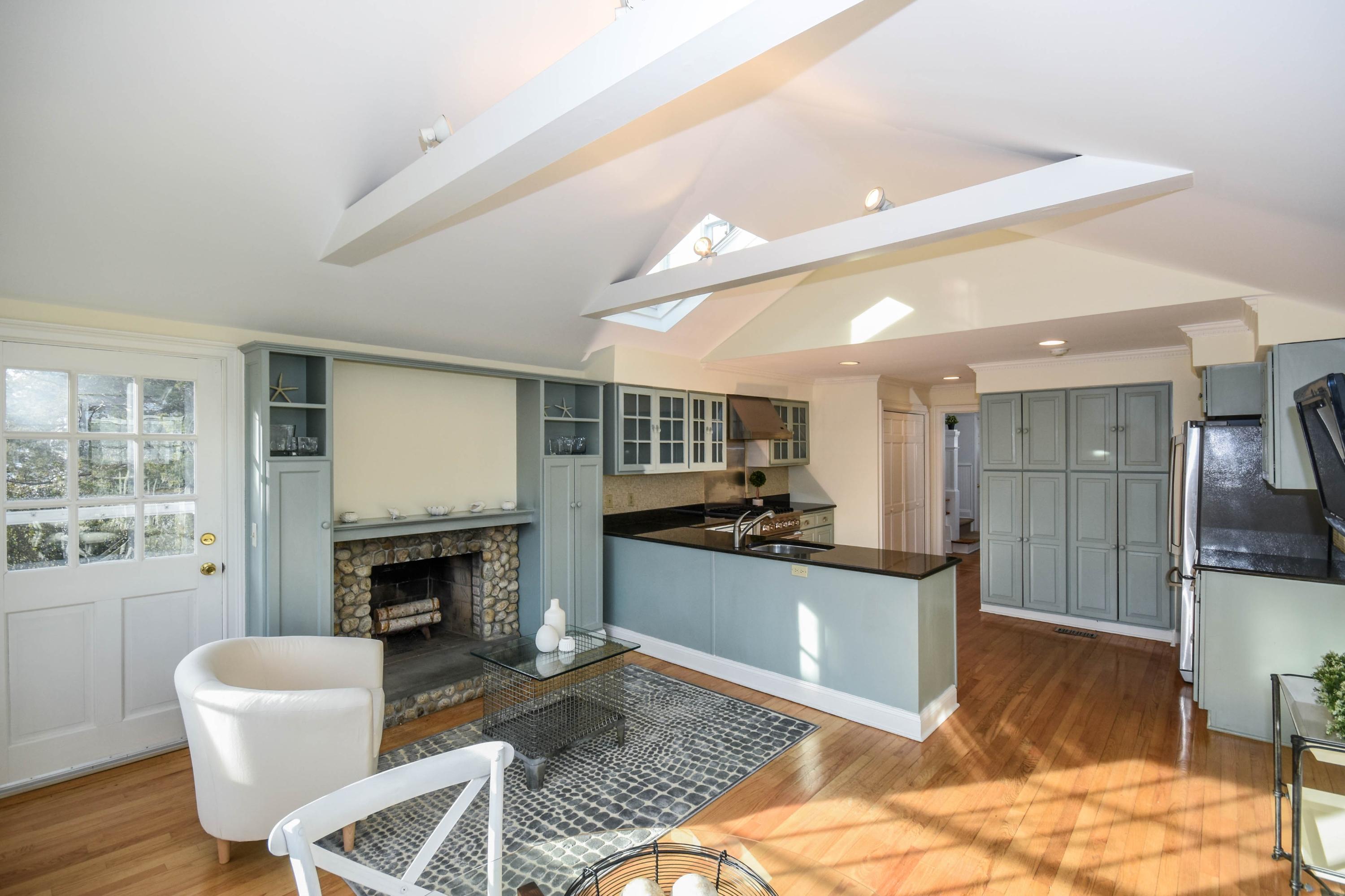 22 Meridian Road Rowayton, CT 06853 - Photo 2 of 25 a kitchen with granite countertop a stove a sink and a refrigerator