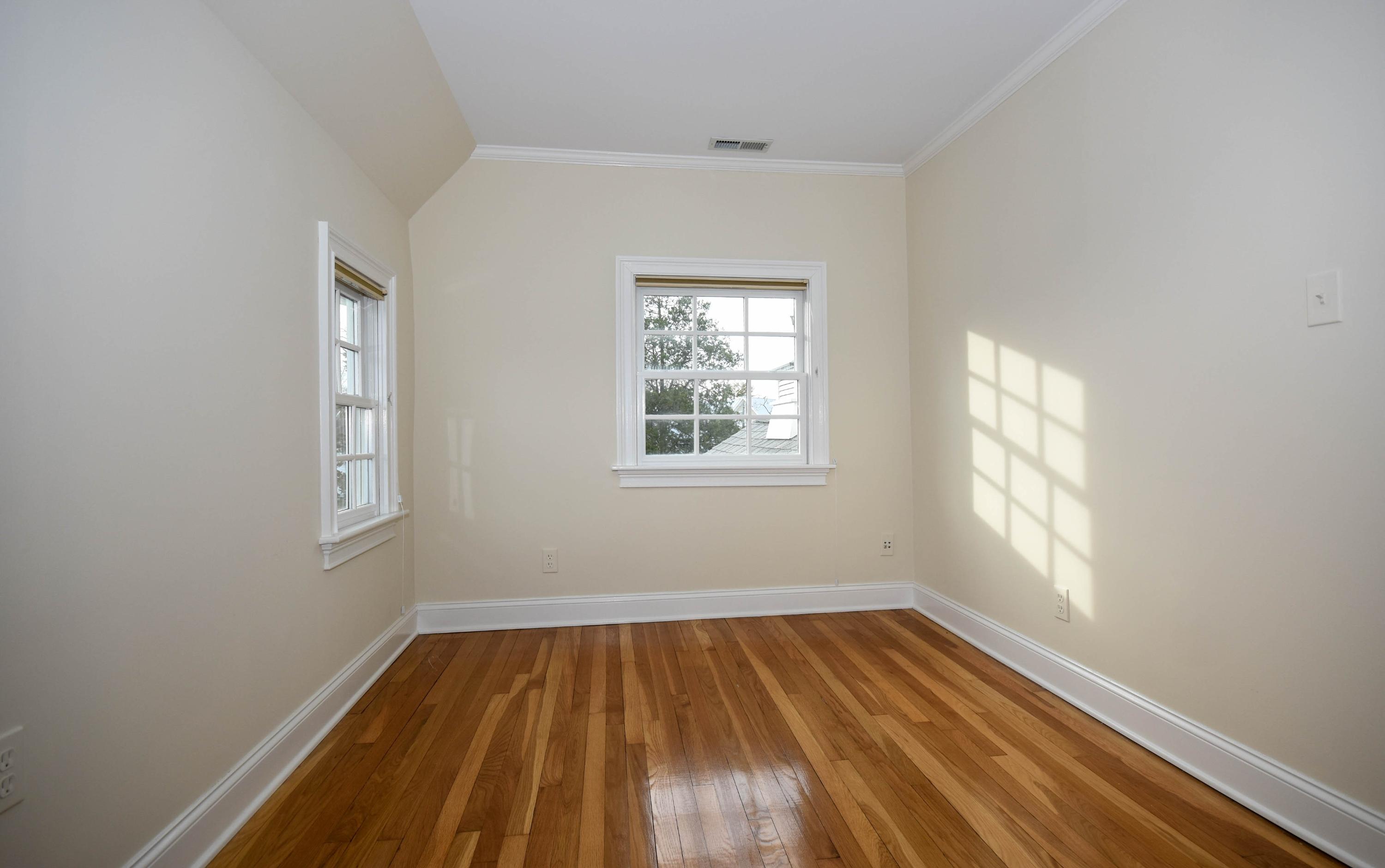 22 Meridian Road Rowayton, CT 06853 - Photo 22 of 25 an empty room with wooden floor and windows