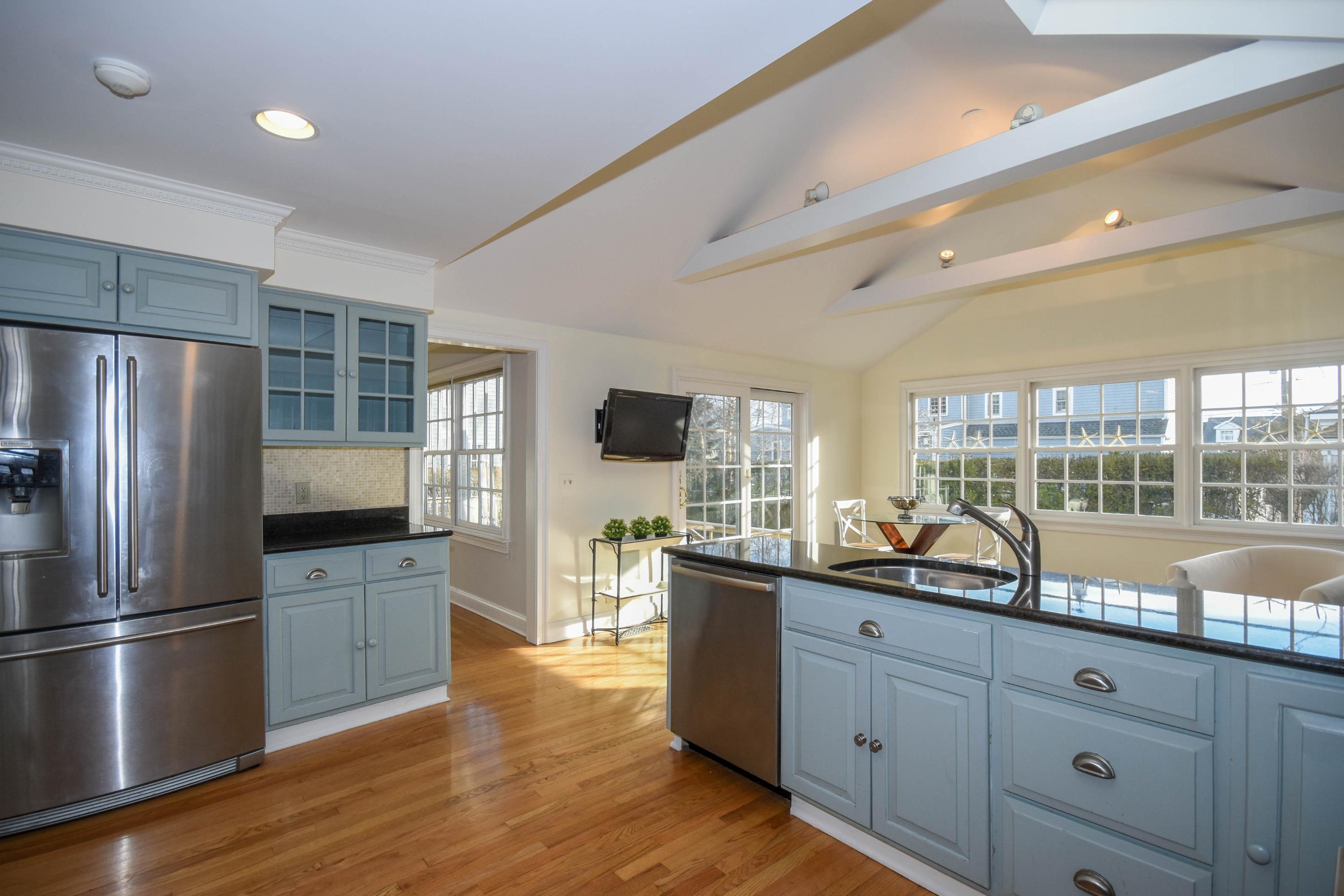 22 Meridian Road Rowayton, CT 06853 - Photo 3 of 25 a kitchen with granite countertop a refrigerator and a sink