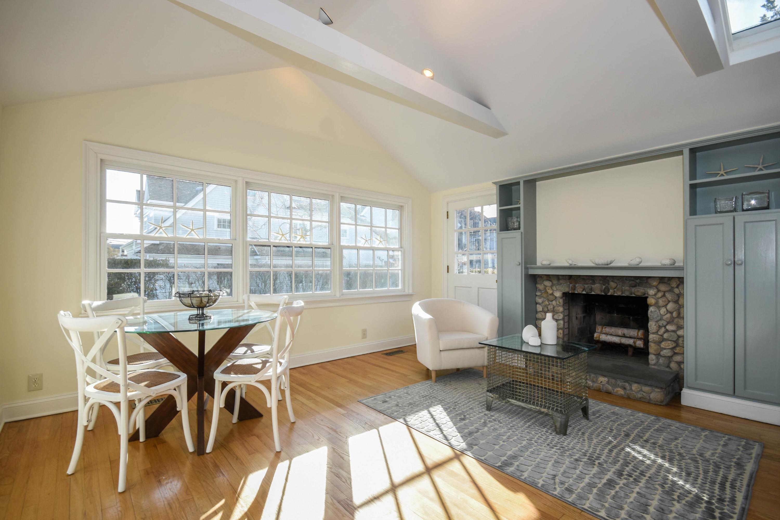22 Meridian Road Rowayton, CT 06853 - Photo 5 of 25 a living room with furniture a fireplace and a table