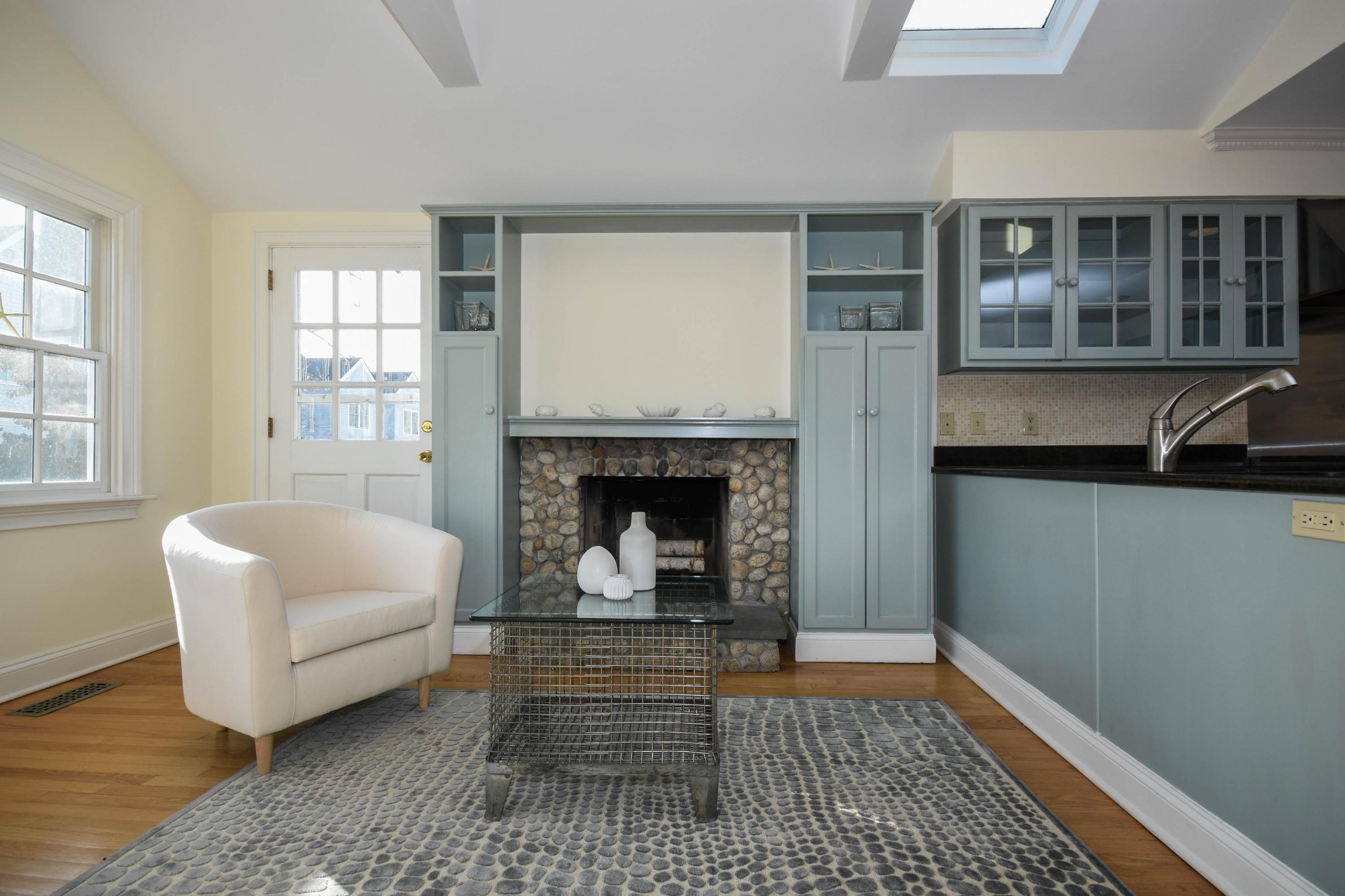 22 Meridian Road Rowayton, CT 06853 - Photo 6 of 25 a living room with furniture and a fireplace