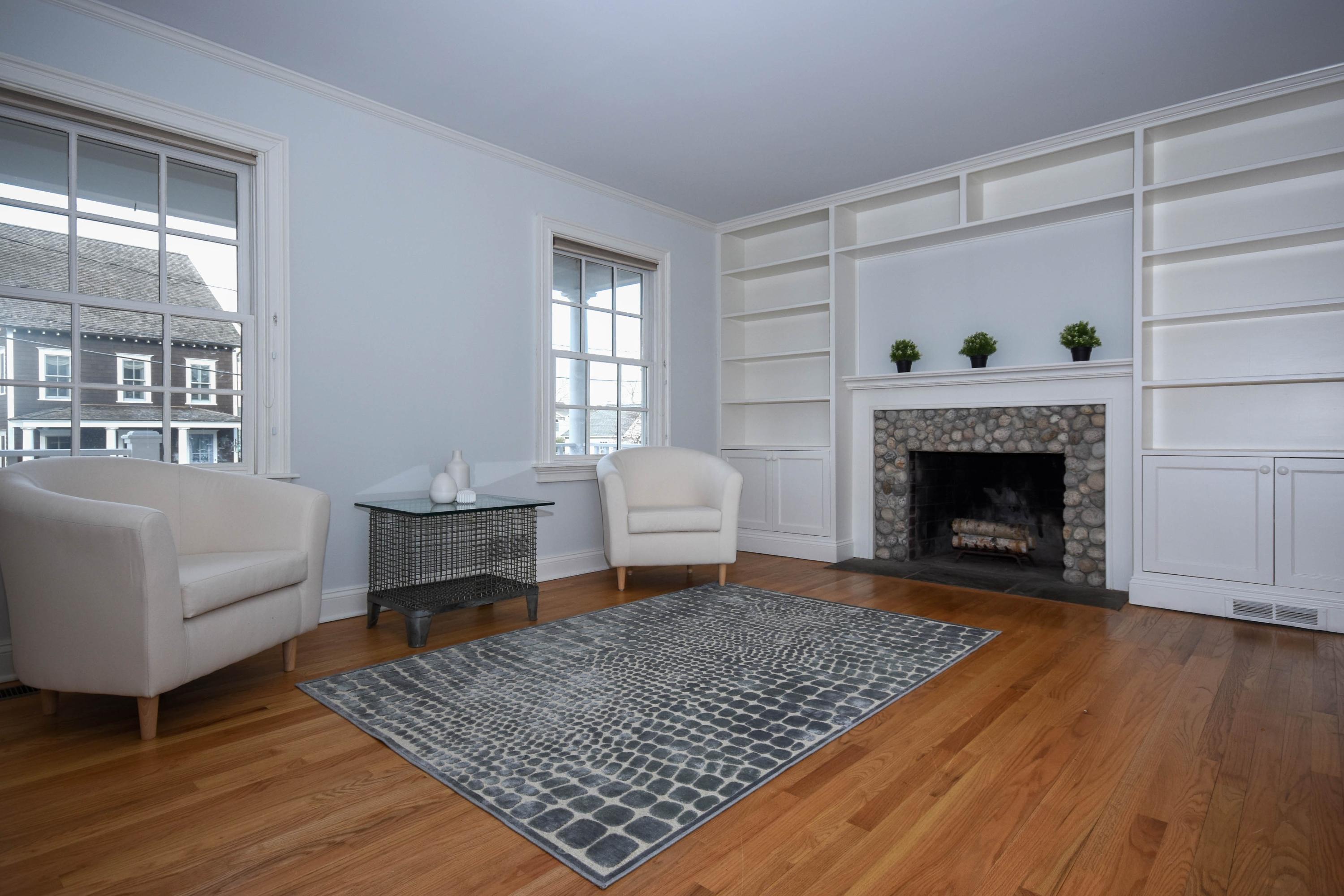 22 Meridian Road Rowayton, CT 06853 - Photo 9 of 25 a living room with furniture and a fireplace