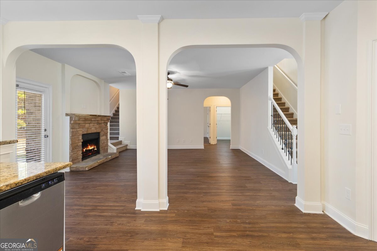 149 Mariahs Walk Hampton, GA 30228 - Photo 14 of 45 a view of a living room with wooden floor and a fireplace