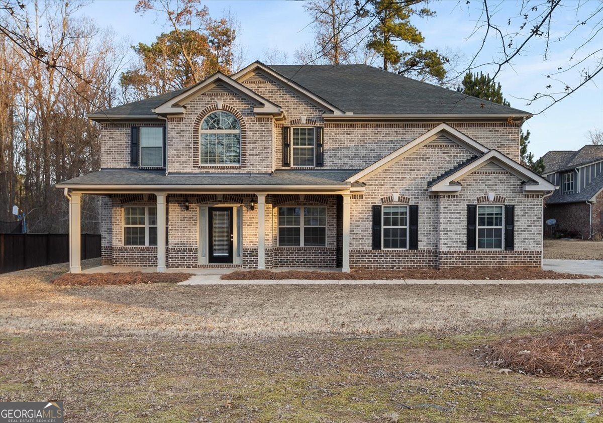149 Mariahs Walk Hampton, GA 30228 - Photo 2 of 45 front view of a house with a porch