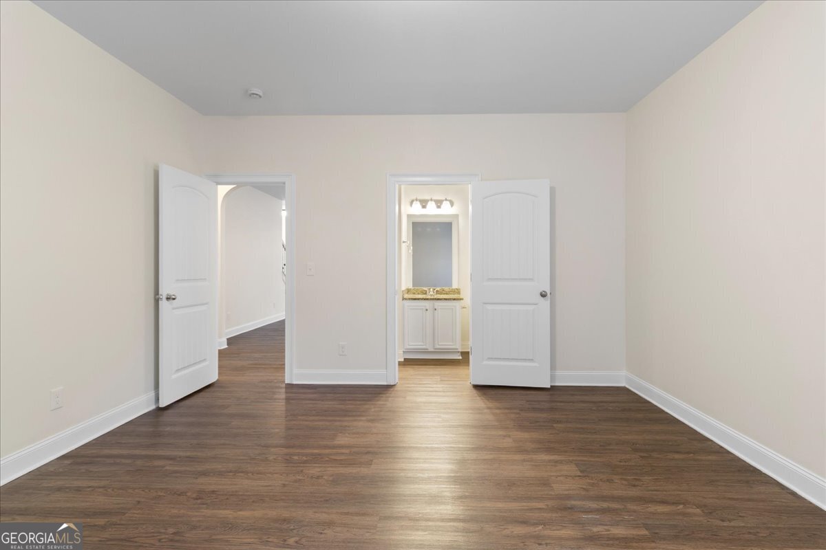 149 Mariahs Walk Hampton, GA 30228 - Photo 21 of 45 a view of empty room with wooden floor
