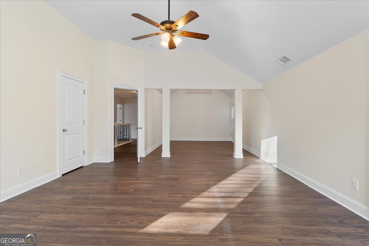 149 Mariahs Walk Hampton, GA 30228 - Photo 26 of 45 a view of an empty room with wooden floor