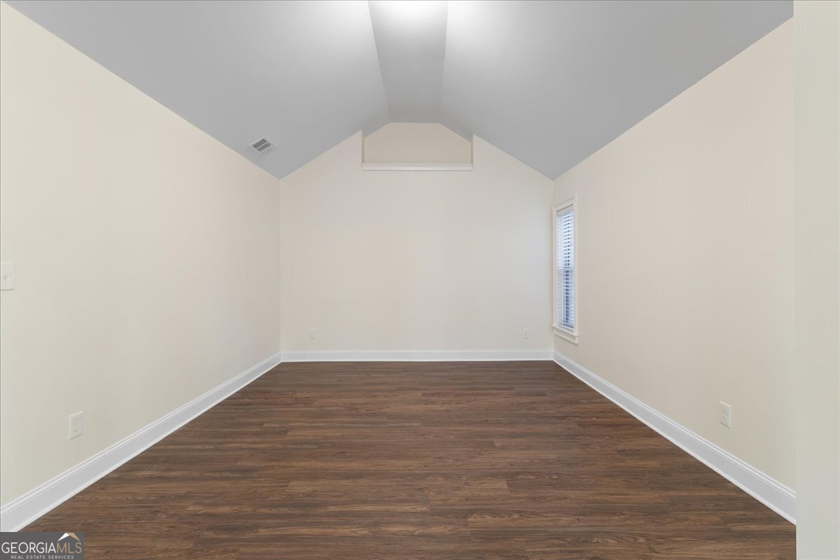 149 Mariahs Walk Hampton, GA 30228 - Photo 27 of 45 a view of an empty room with wooden floor