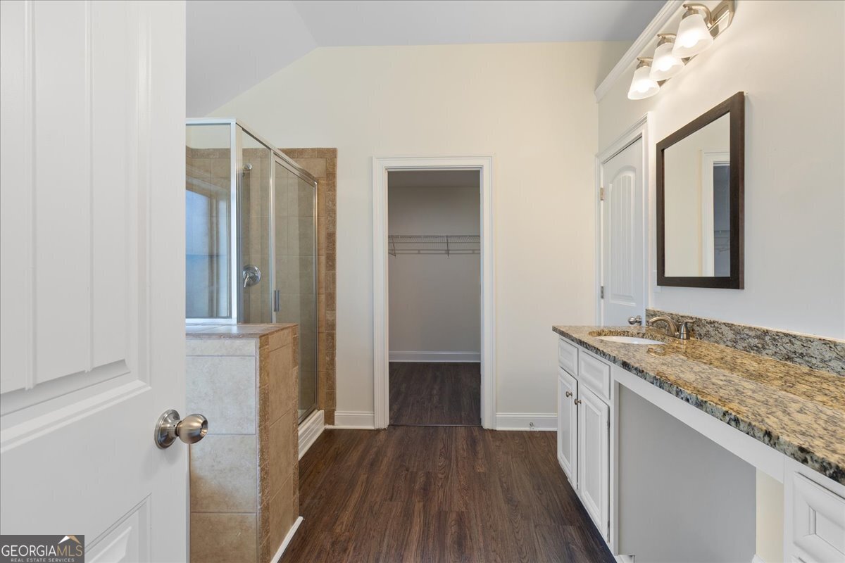 149 Mariahs Walk Hampton, GA 30228 - Photo 30 of 45 a bathroom with a granite countertop sink and a mirror