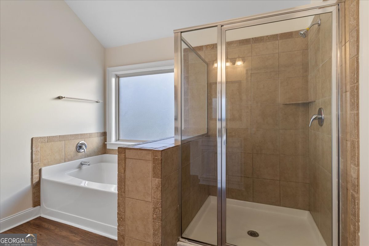 149 Mariahs Walk Hampton, GA 30228 - Photo 32 of 45 a bathroom with a bathtub and shower