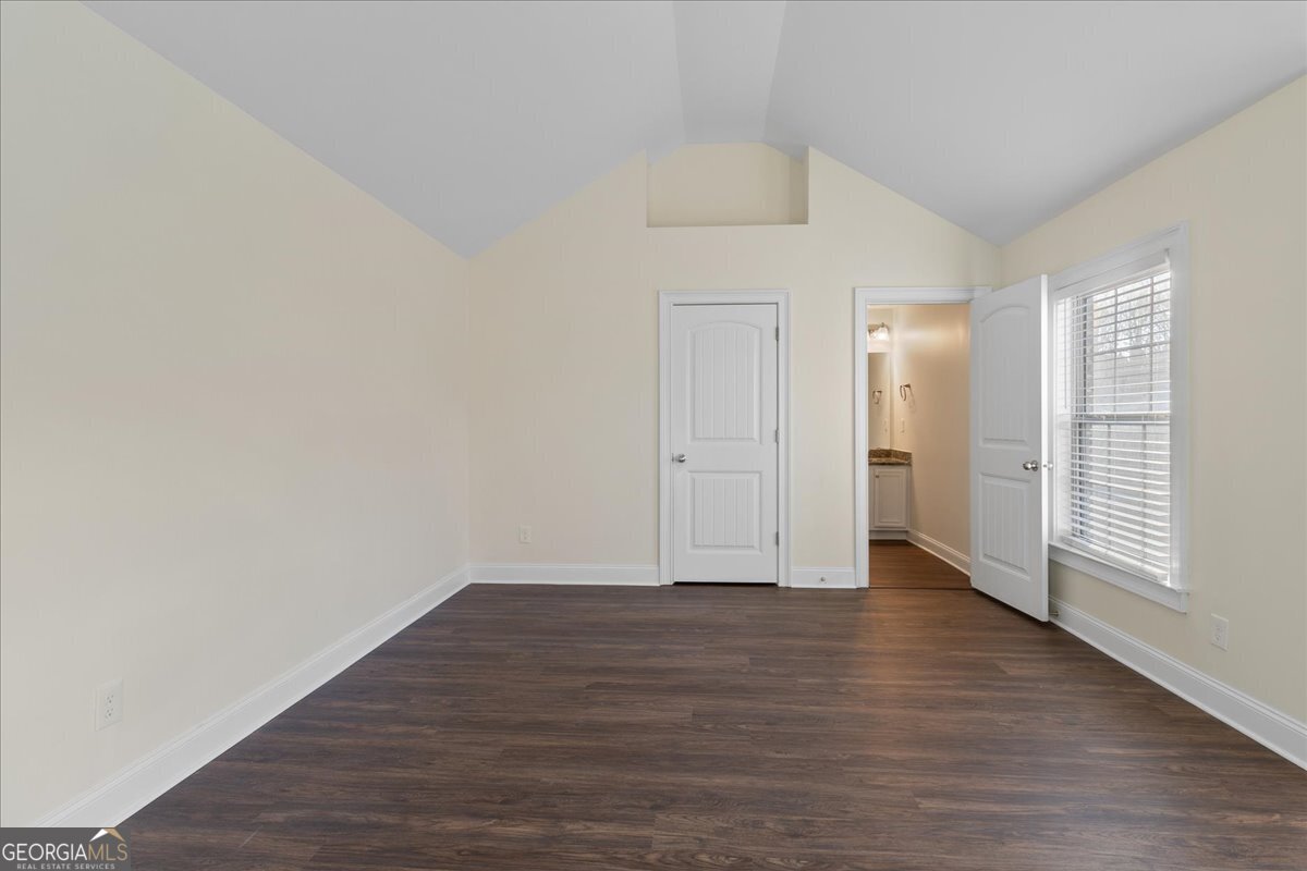 149 Mariahs Walk Hampton, GA 30228 - Photo 34 of 45 a view of an empty room with wooden floor and a window