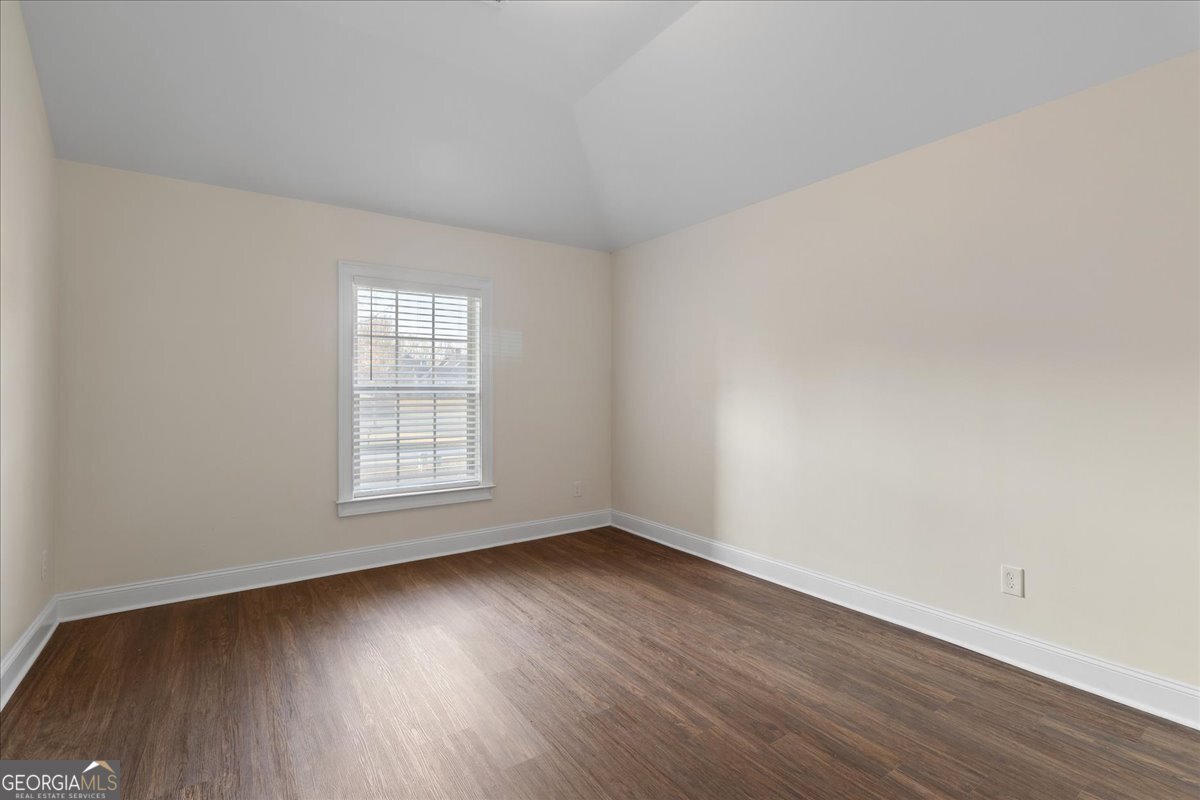 149 Mariahs Walk Hampton, GA 30228 - Photo 36 of 45 an empty room with wooden floor and windows