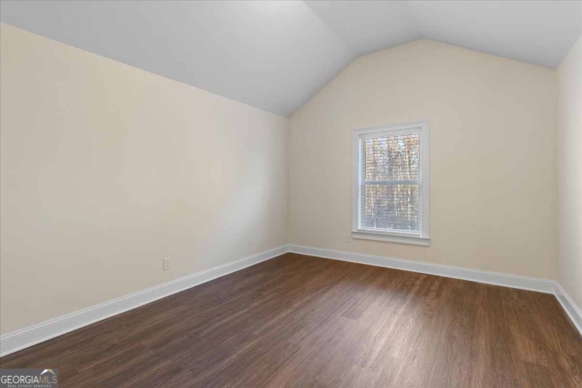 149 Mariahs Walk Hampton, GA 30228 - Photo 37 of 45 an empty room with wooden floor and windows