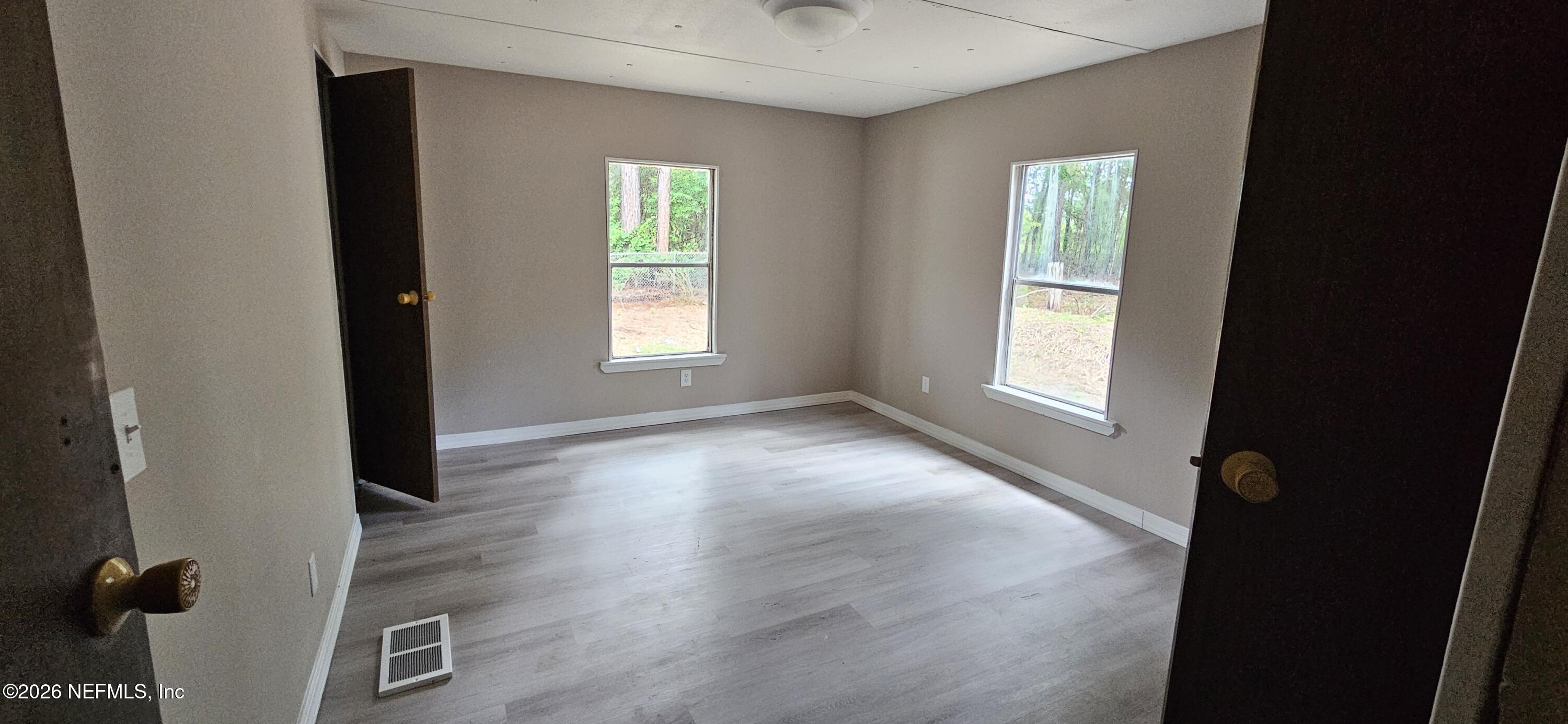 5363 Kilcrease Road Jacksonville, FL 32234 - Photo 17 of 29 an empty room with windows