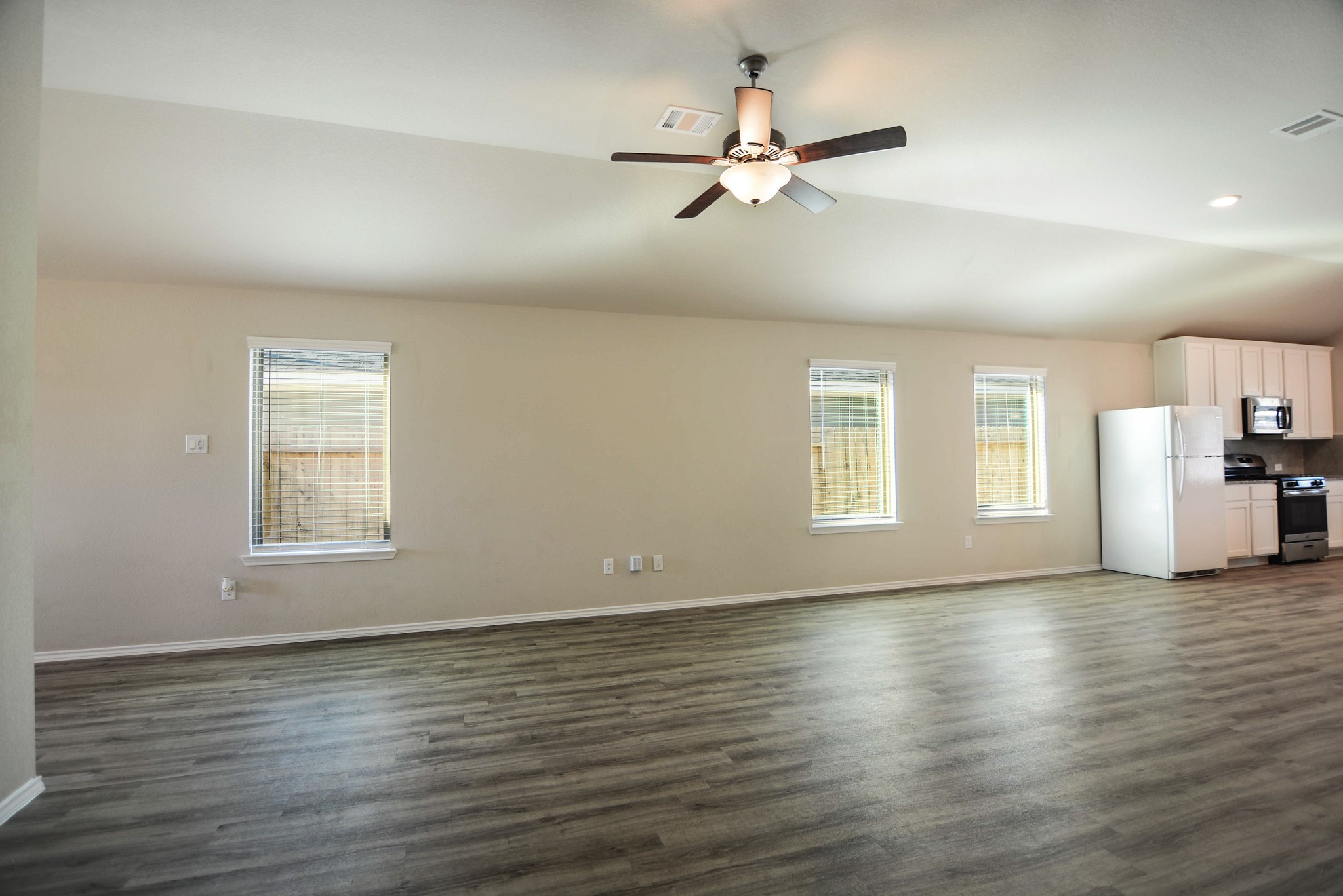 21434 Holly Heights Road Cypress, TX 77433 - Photo 4 of 17 a view of an empty room with wooden floor and a window