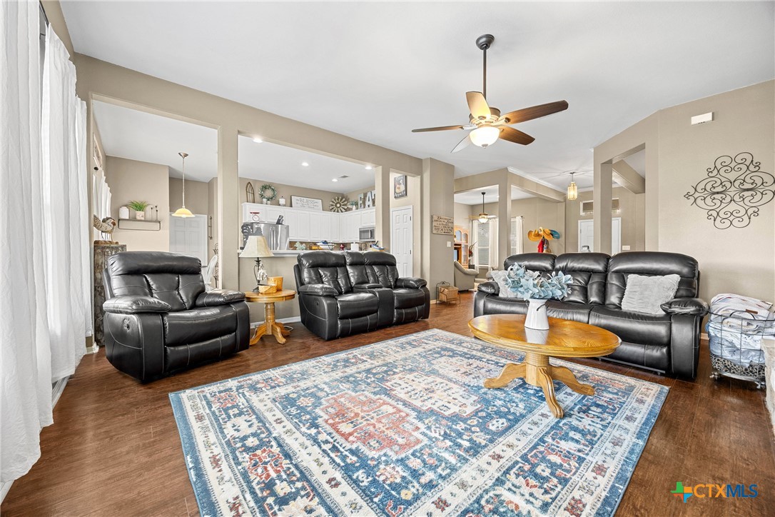 350 Lehne Road Bertram, TX 78605 - Photo 11 of 33 a living room with furniture a rug and a chandelier