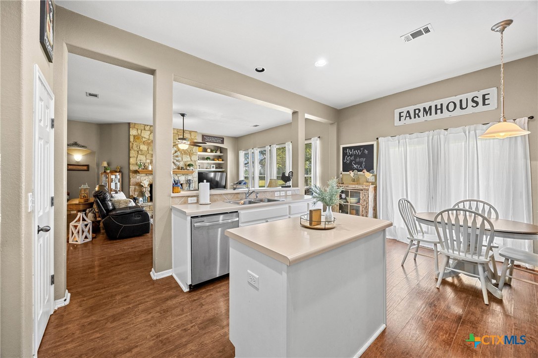 350 Lehne Road Bertram, TX 78605 - Photo 15 of 33 a open kitchen with a table and chairs
