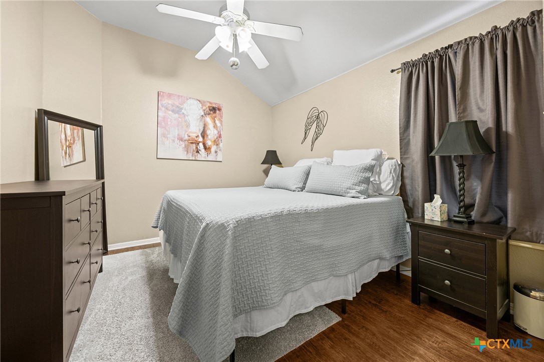 350 Lehne Road Bertram, TX 78605 - Photo 17 of 33 a bedroom with a bed and a dresser