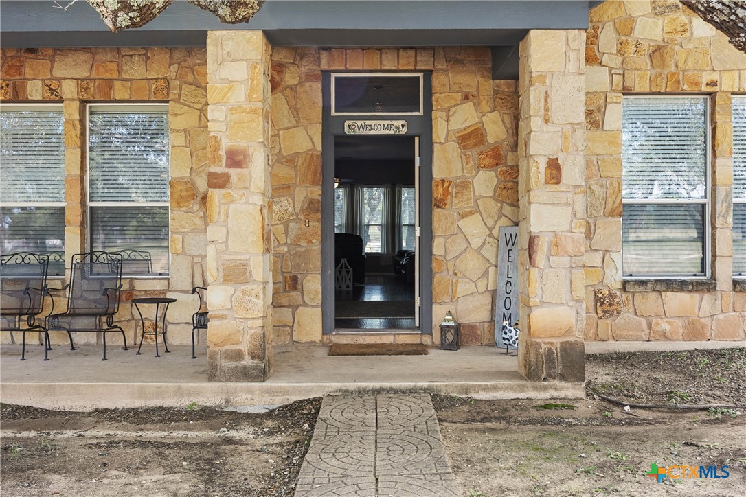 350 Lehne Road Bertram, TX 78605 - Photo 2 of 33 a front view of a brick house with a large window