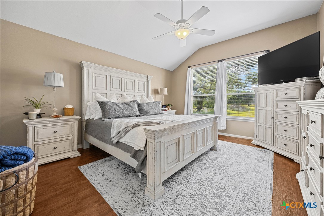 350 Lehne Road Bertram, TX 78605 - Photo 21 of 33 a bedroom with a bed and a flat screen tv