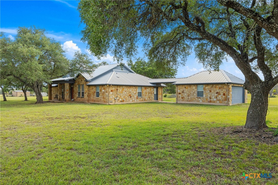 350 Lehne Road Bertram, TX 78605 - Photo 3 of 33 a front view of a house with garden