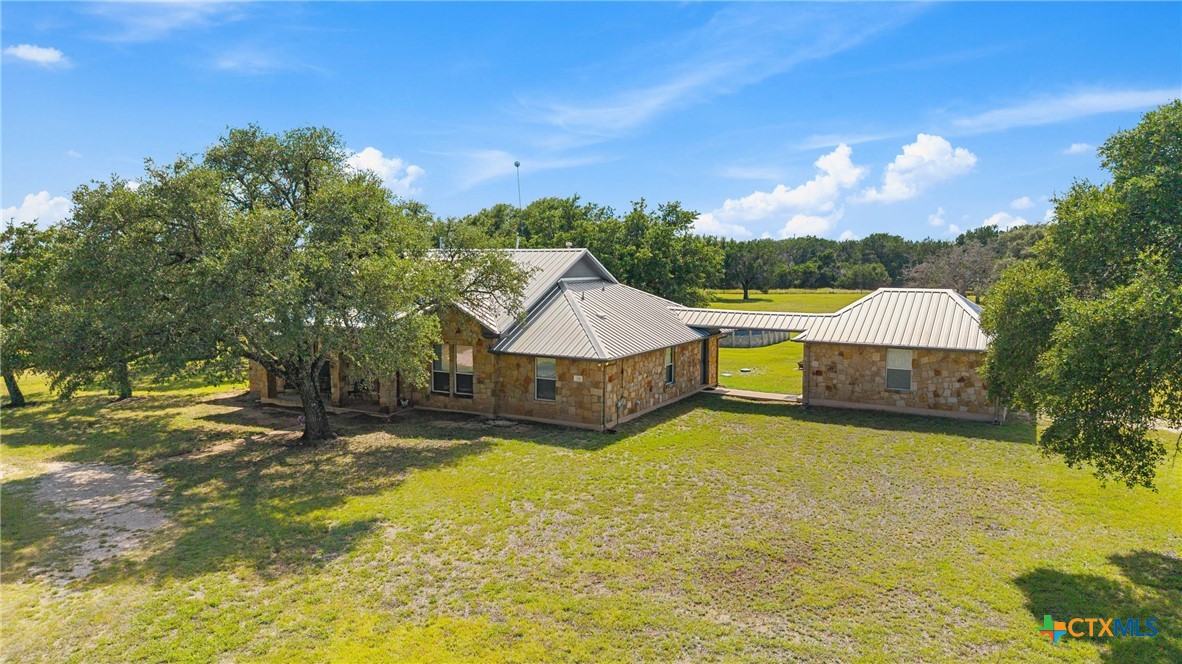 350 Lehne Road Bertram, TX 78605 - Photo 31 of 33 a view of a swimming pool with a yard and a large tree