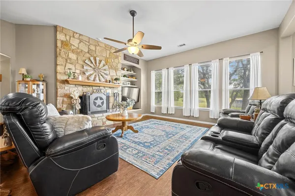 a living room with furniture and a rug