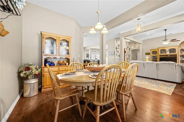 a open kitchen with a table and chairs