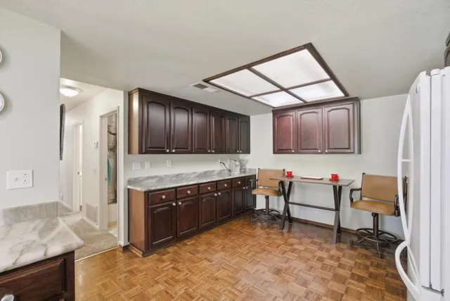 a spacious bathroom with a sink and a large mirror