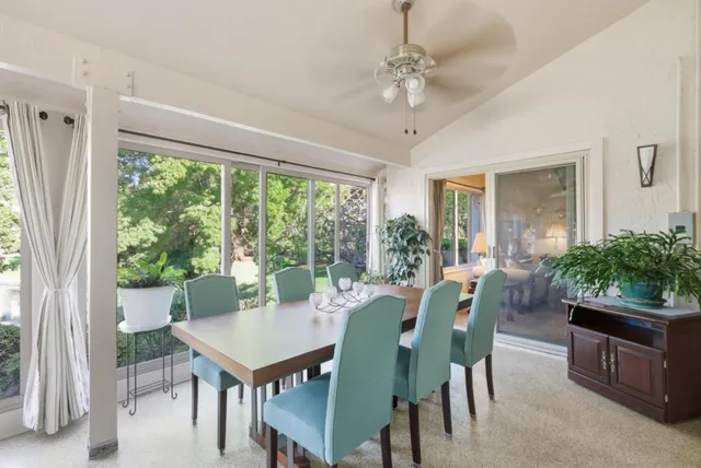 a view of a dining room with furniture window and outside view