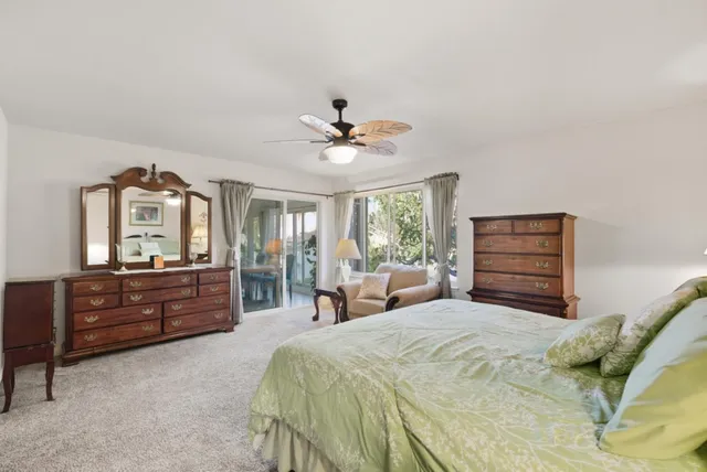 a bed room with a bed and a dresser