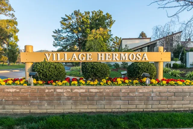 a view of sign board with flowers
