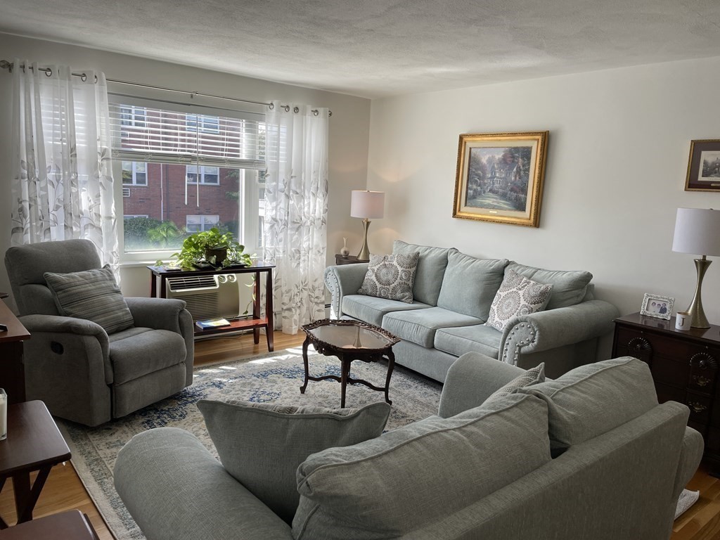 32 Whitman Road, Unit 12 Waltham, MA 02453 - Photo 11 of 19 a living room with furniture and a large window