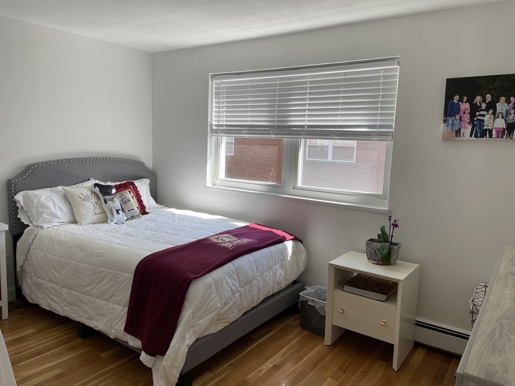 32 Whitman Road, Unit 12 Waltham, MA 02453 - Photo 15 of 19 a bedroom with a bed and a window
