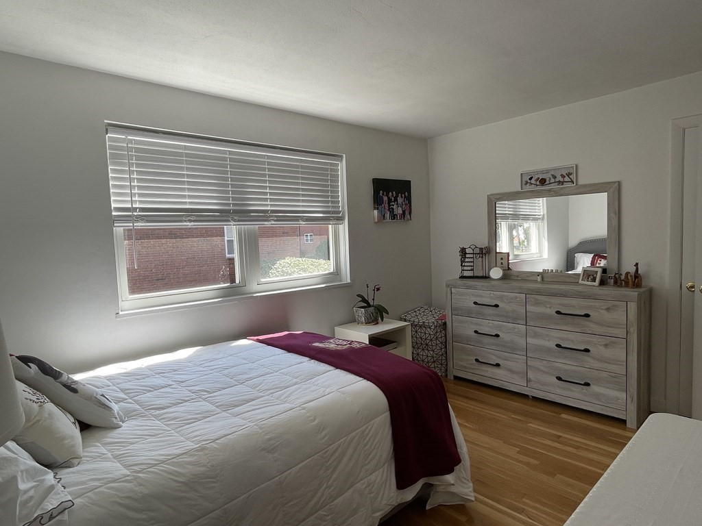 32 Whitman Road, Unit 12 Waltham, MA 02453 - Photo 17 of 19 a bedroom with a bed and a window