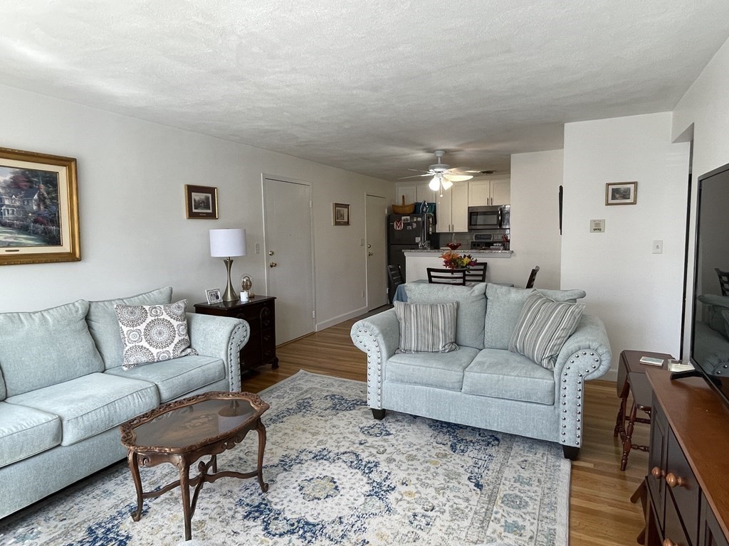 32 Whitman Road, Unit 12 Waltham, MA 02453 - Photo 7 of 19 a living room with furniture and a couch
