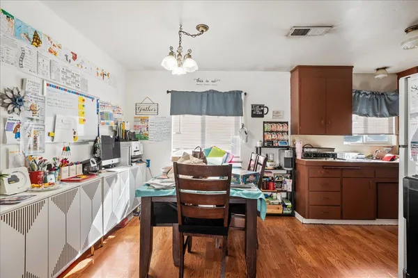 a living room with kitchen island furniture and a kitchen view