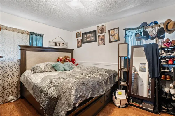 a bedroom with a bed and cabinets