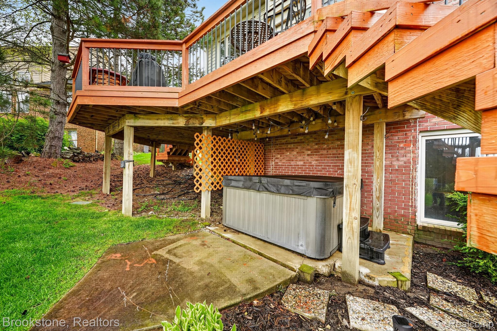 4054 Calumet Drive Rochester, MI 48306 - Photo 42 of 44 Exterior view of a jacuzzi and brick siding