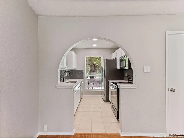 a view of a kitchen with a sink