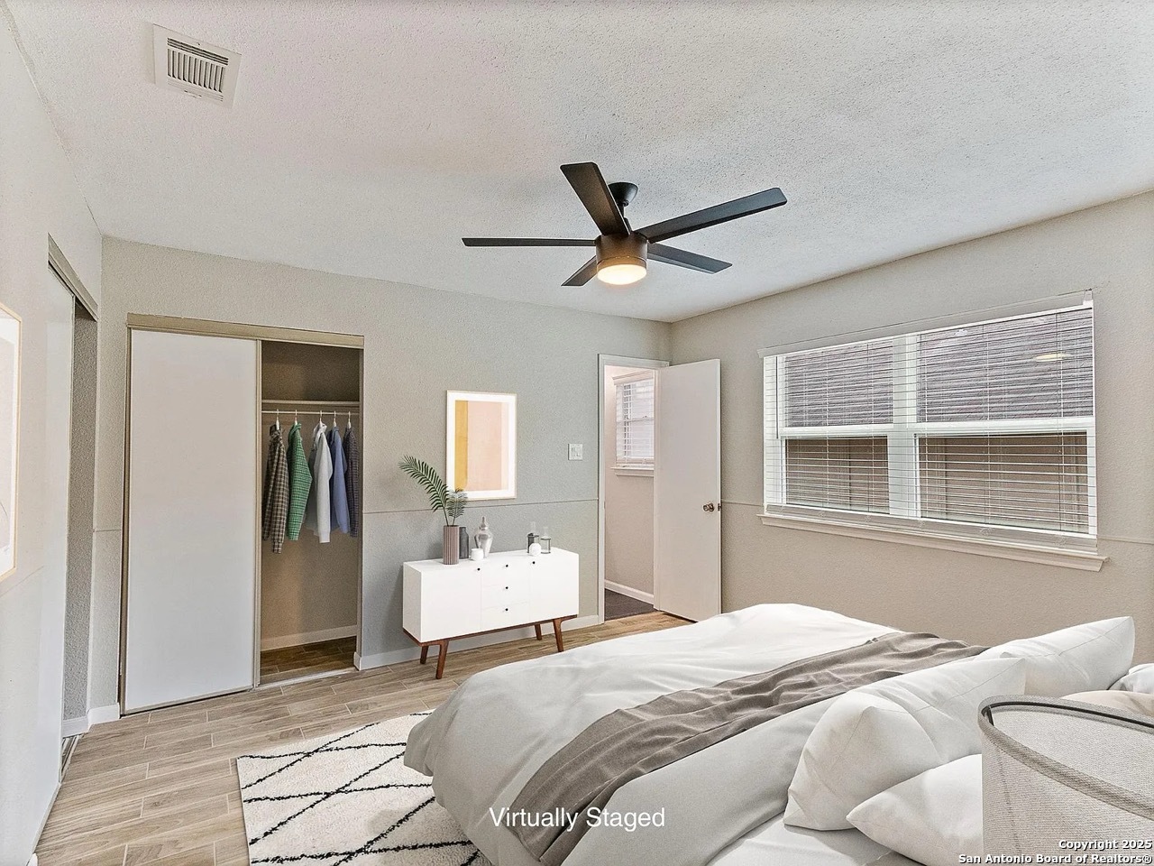 717 Meadow Gate Converse, TX 78109 - Photo 18 of 34 a bedroom with a bed and a window