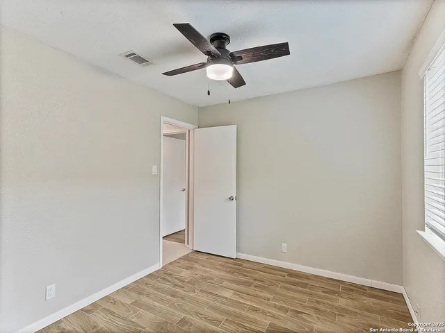 a view of an empty room and window