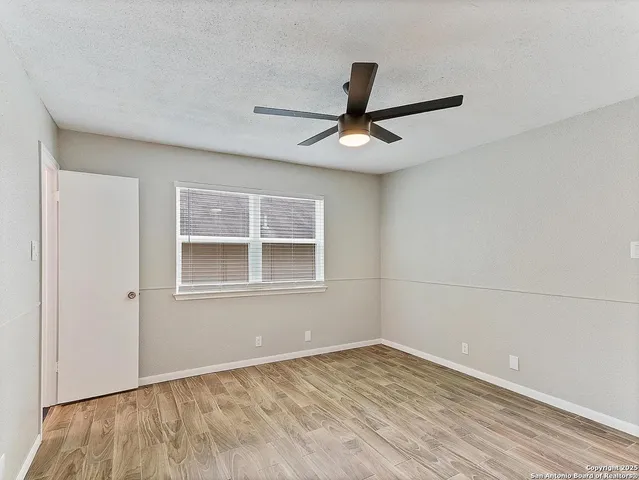 an empty room with a empty space and a window