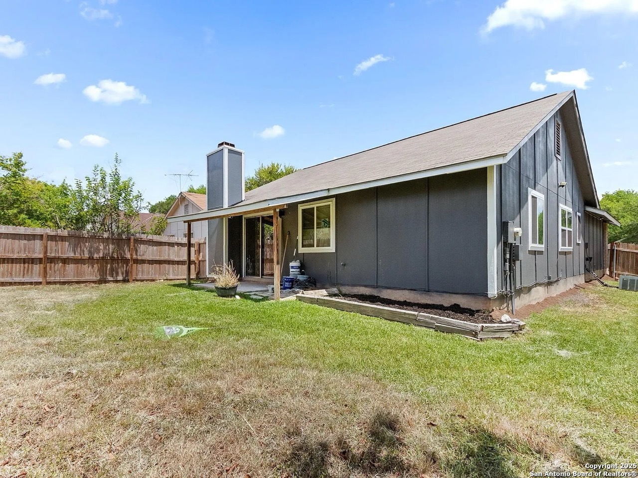 717 Meadow Gate Converse, TX 78109 - Photo 31 of 34 a front view of a house with a yard