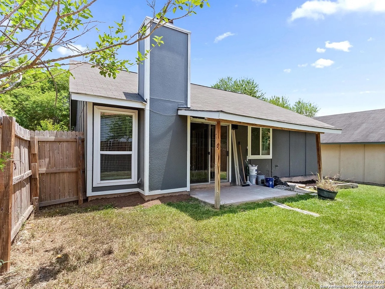 717 Meadow Gate Converse, TX 78109 - Photo 32 of 34 a front view of a house with a garden and patio