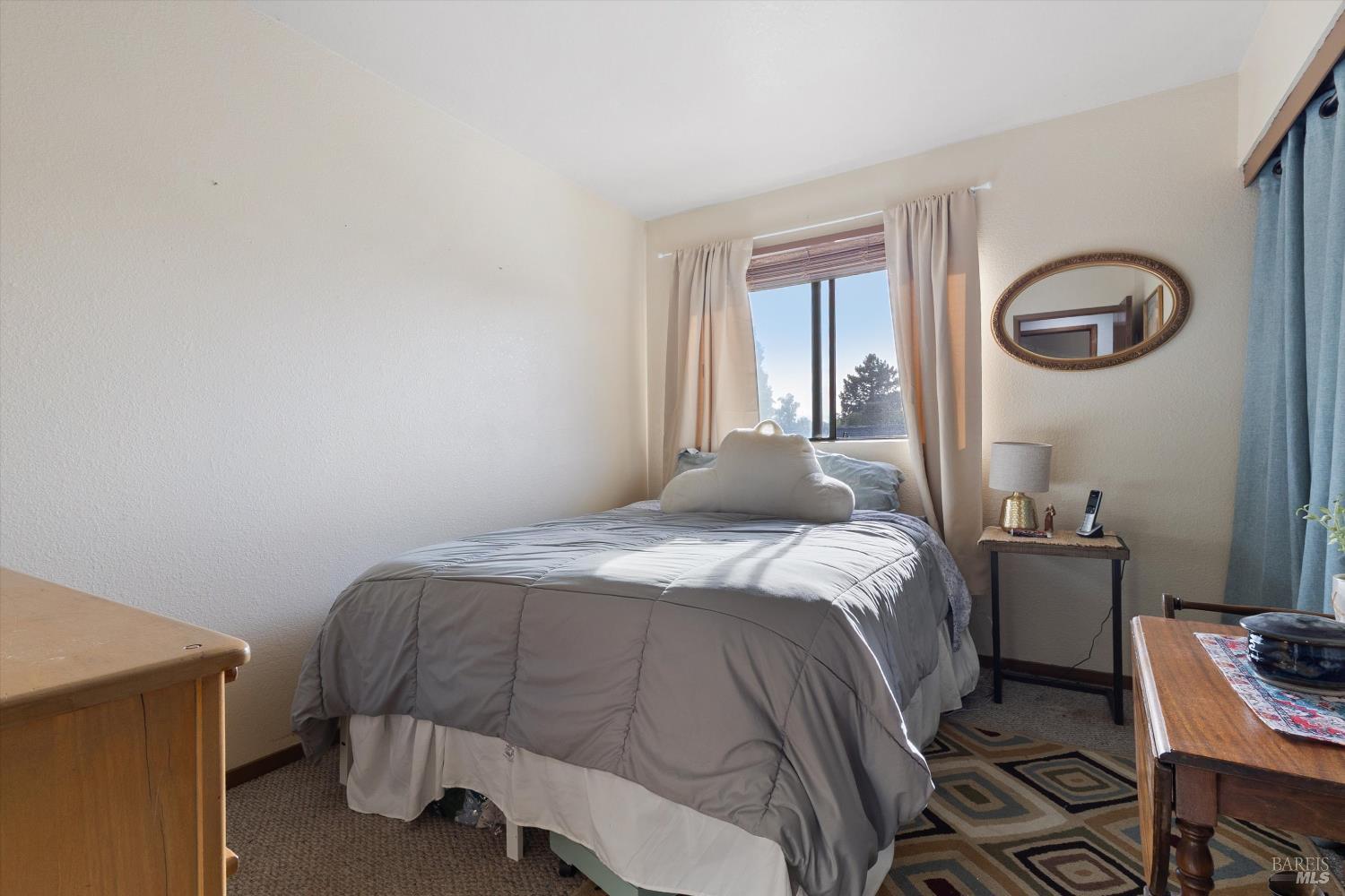 101 Pinewood Court Cotati, CA 94931 - Photo 14 of 21 a bedroom with a bed and a window