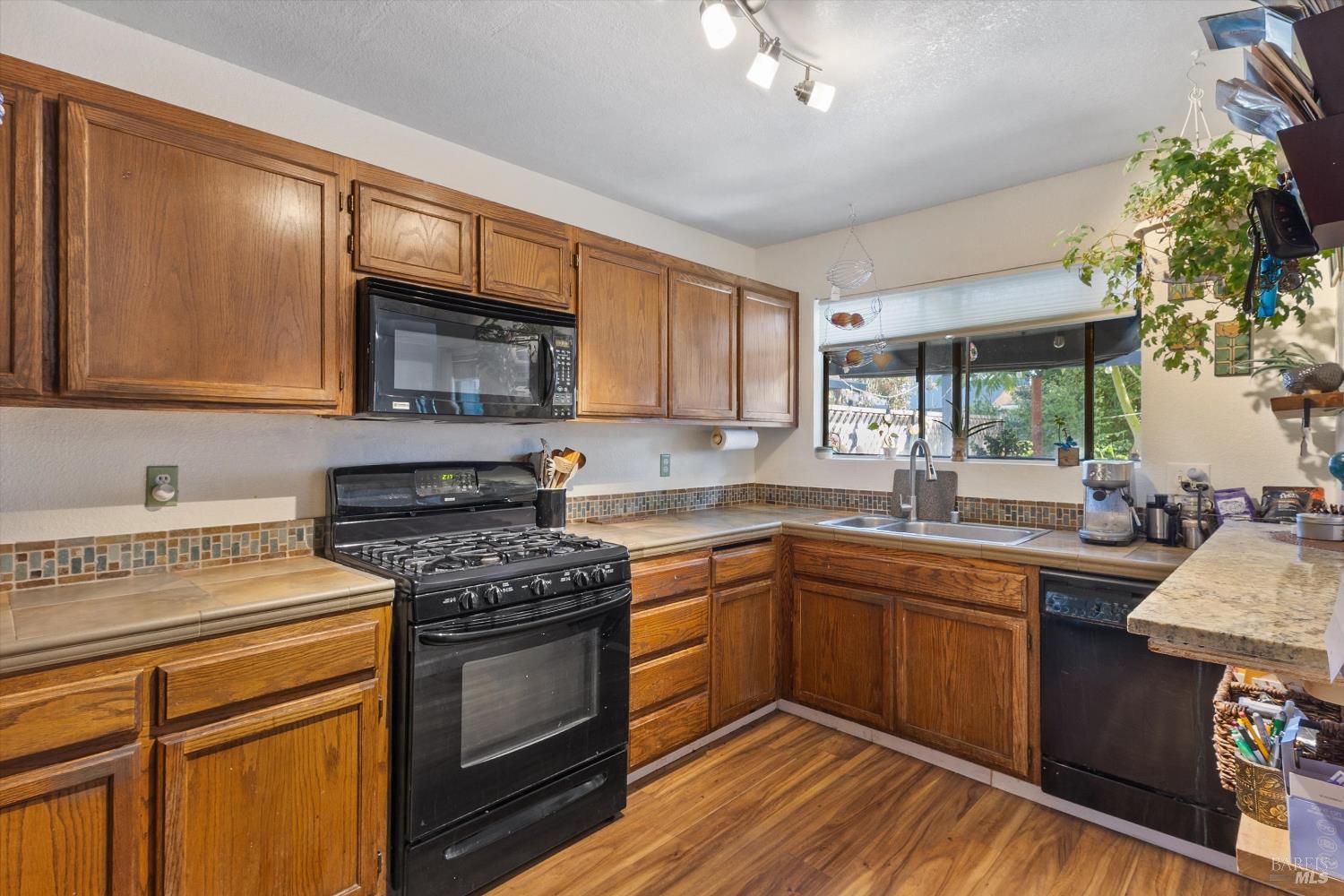 101 Pinewood Court Cotati, CA 94931 - Photo 10 of 21 a kitchen with a sink stove and microwave