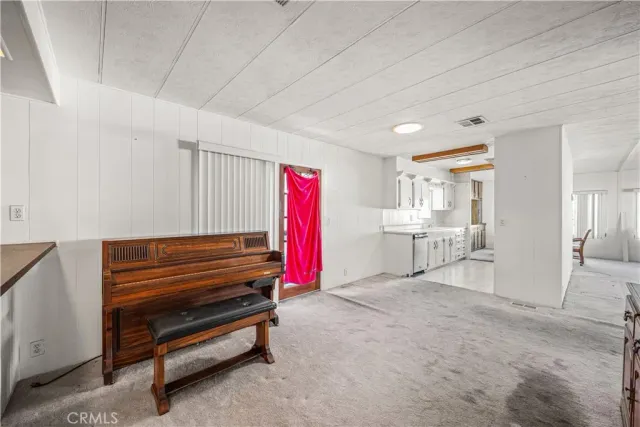 a view of game room with air conditioner and window